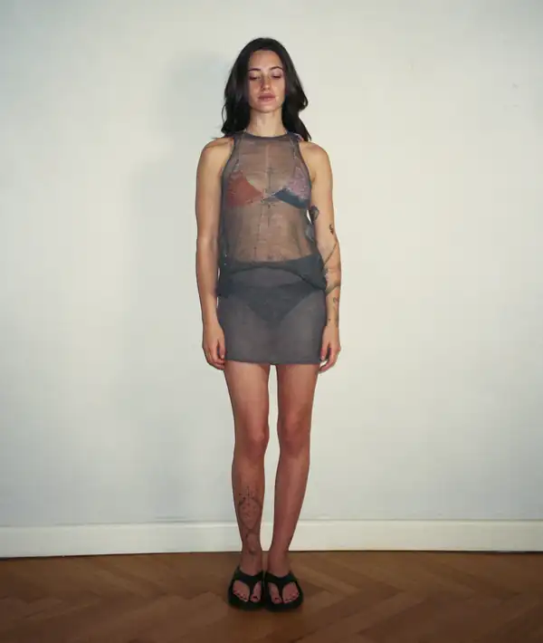 Front, full-length: grey/charcoal sheer knit dress over blue underwear, black flip-flops.