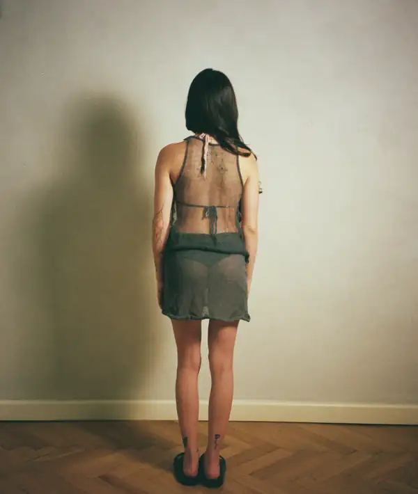 Back: same dress, showing the back neckline and the underwear beneath.