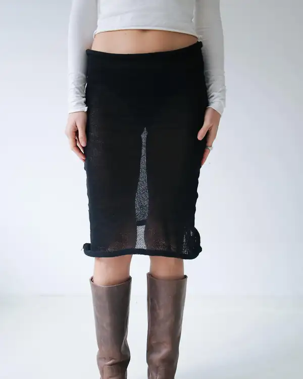 Back: the black knit pencil skirt, brown boots.