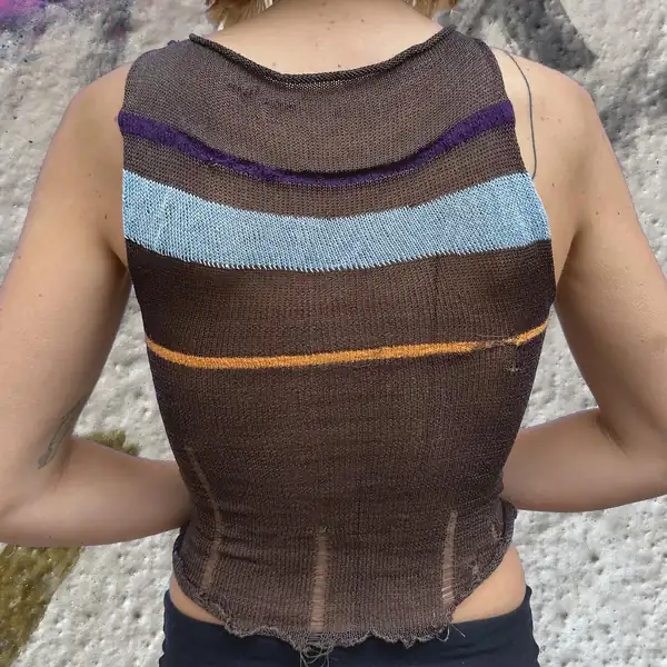 Back: the same top showing purple, pale-blue and orange chevron stripes across the yoke.