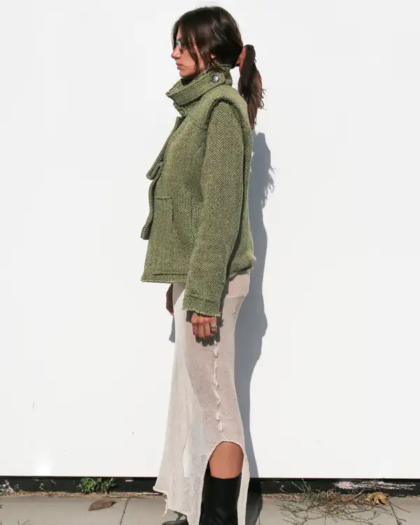 Opposite profile: collar up, jacket closed.
