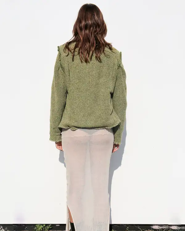 Back: the jacket and the full-length cream skirt.