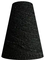 A cone of dark boucle yarn.